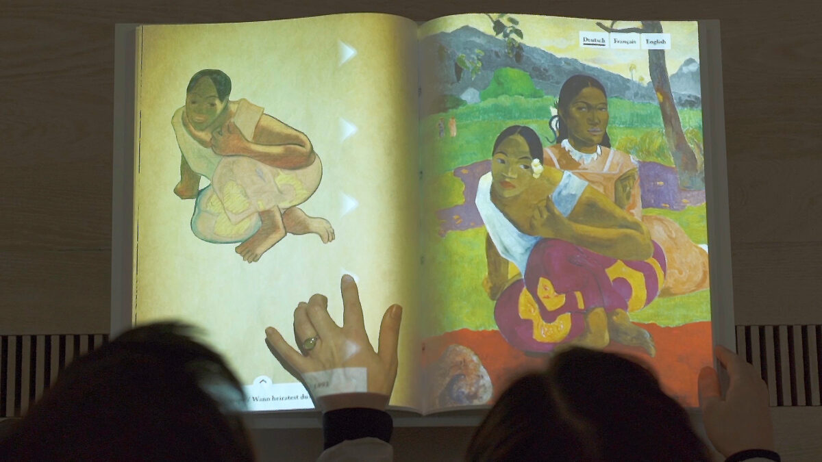 Fondation Beyeler Paul Gauguin Exhibition Interactive Book Hand touching Top View